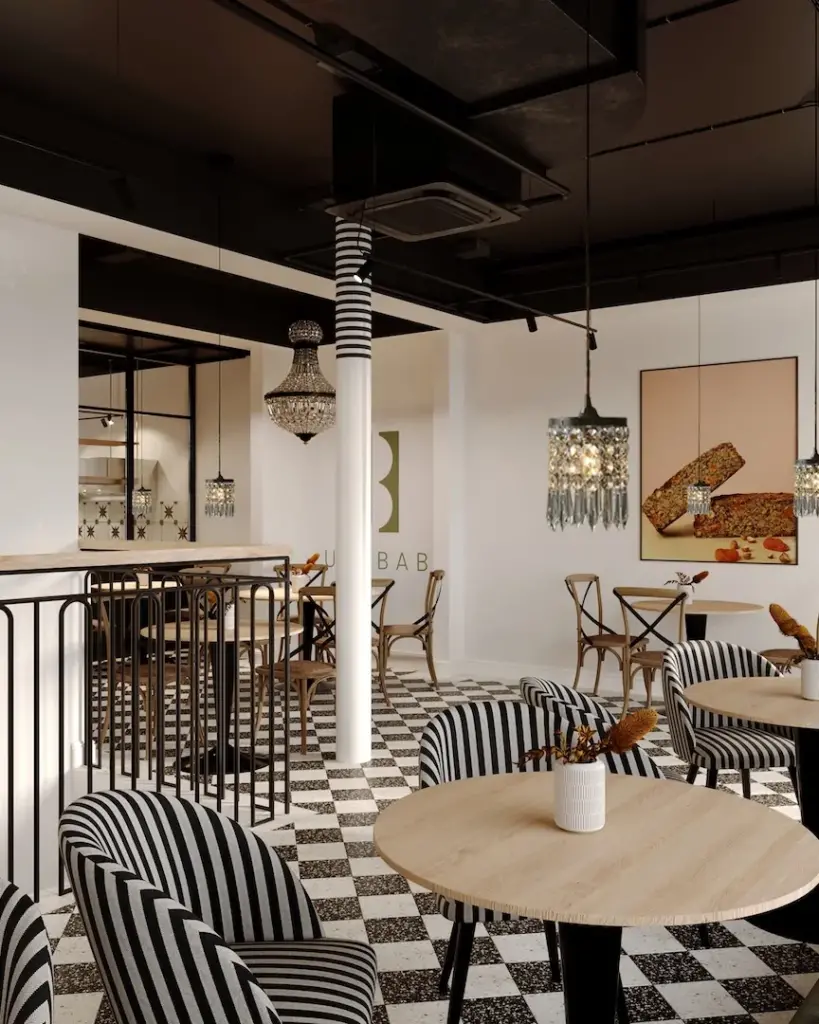 Café-Bereich mit Galerie, Pendelleuchten und gestreiften Sesseln